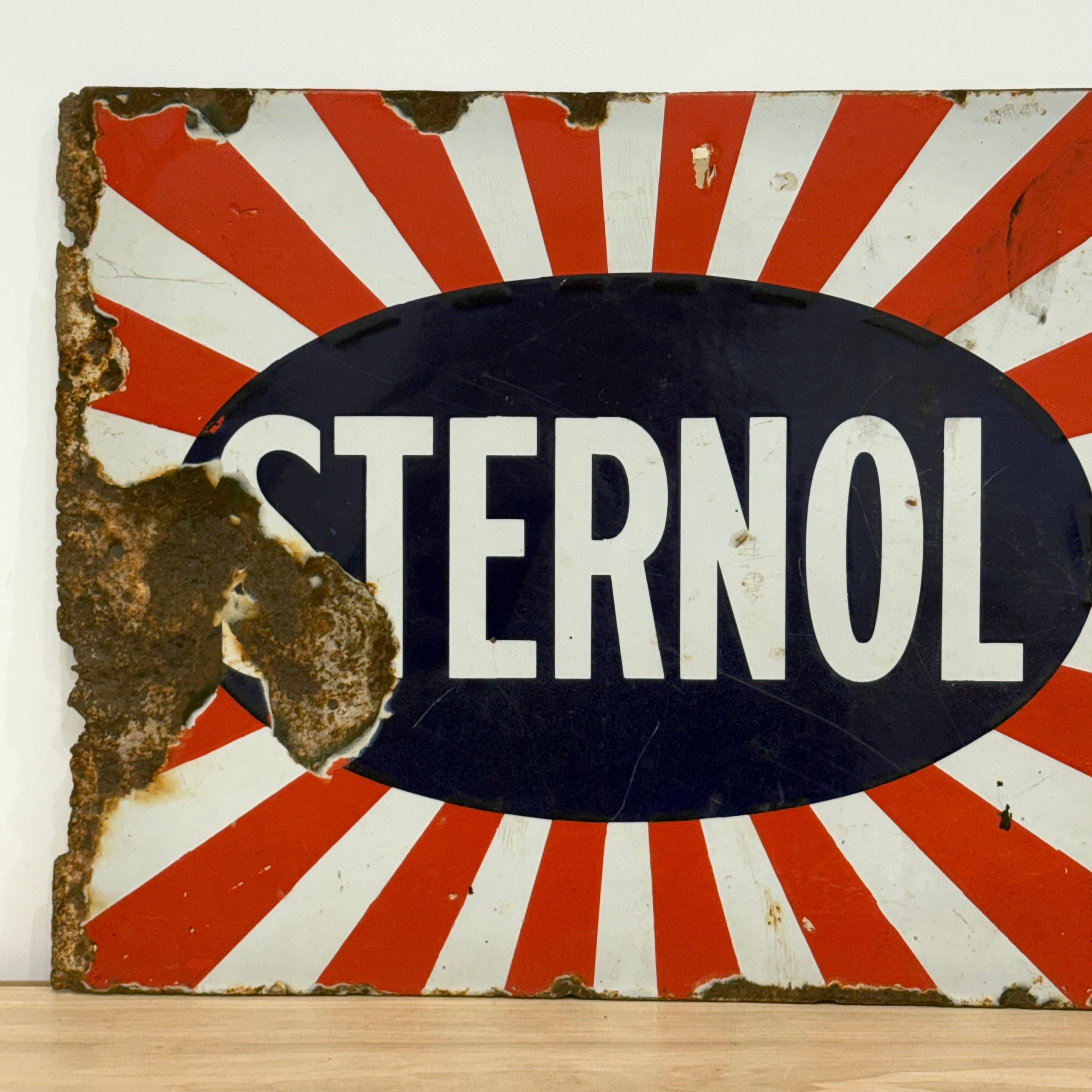 Original Sternol sunburst enamel advertising sign