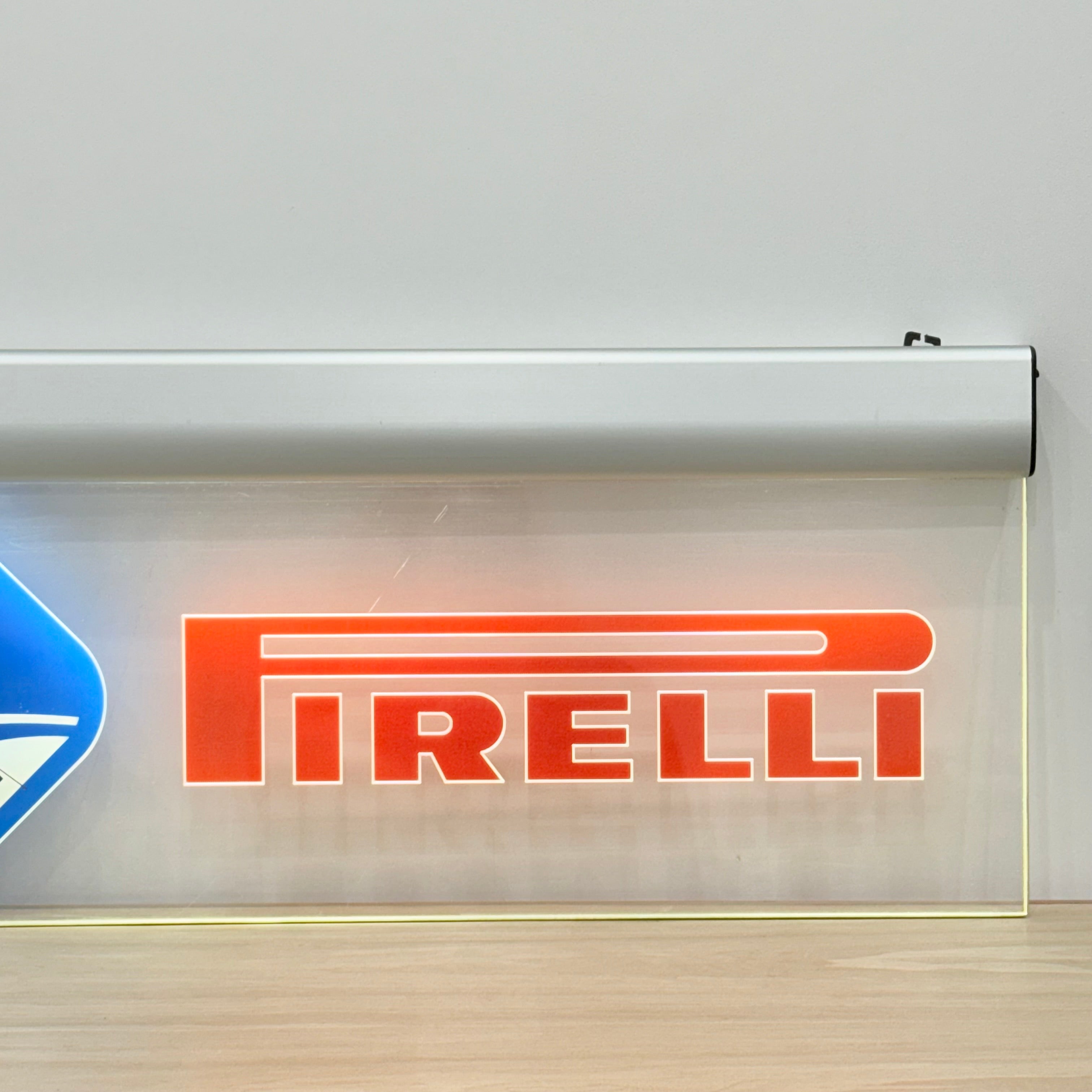 Illuminated Pirelli garage advertising lightbox sign with clock