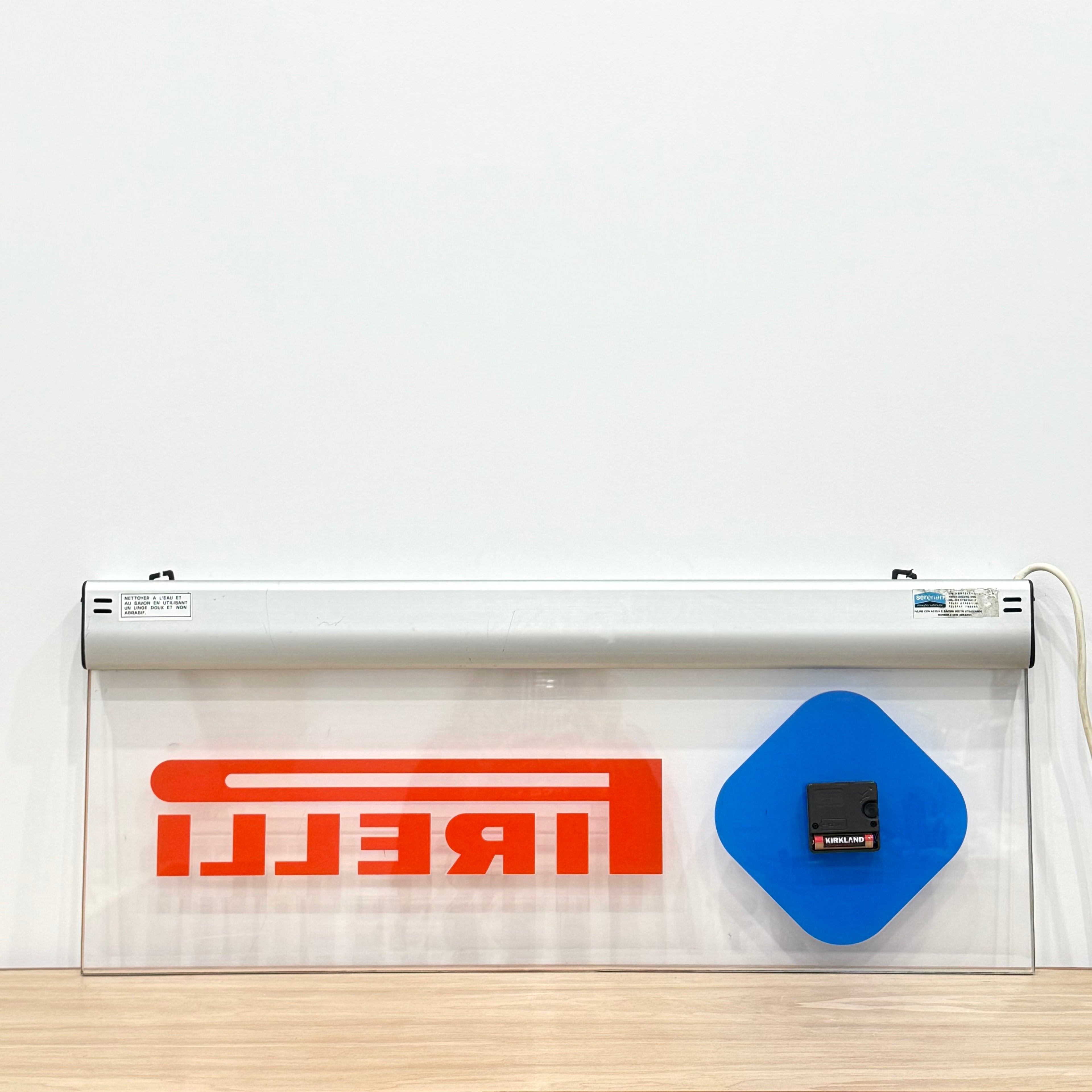 Illuminated Pirelli garage advertising lightbox sign with clock