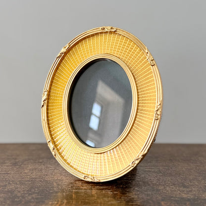 Gold oval frame