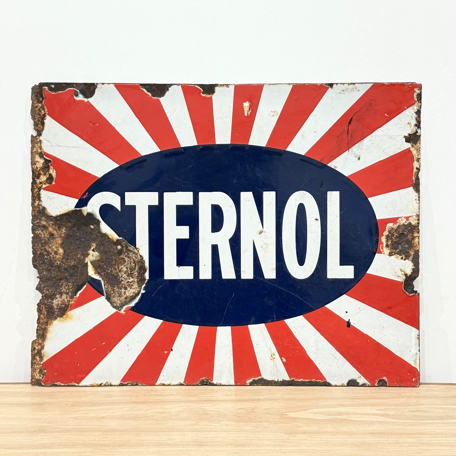 Original Sternol sunburst enamel advertising sign