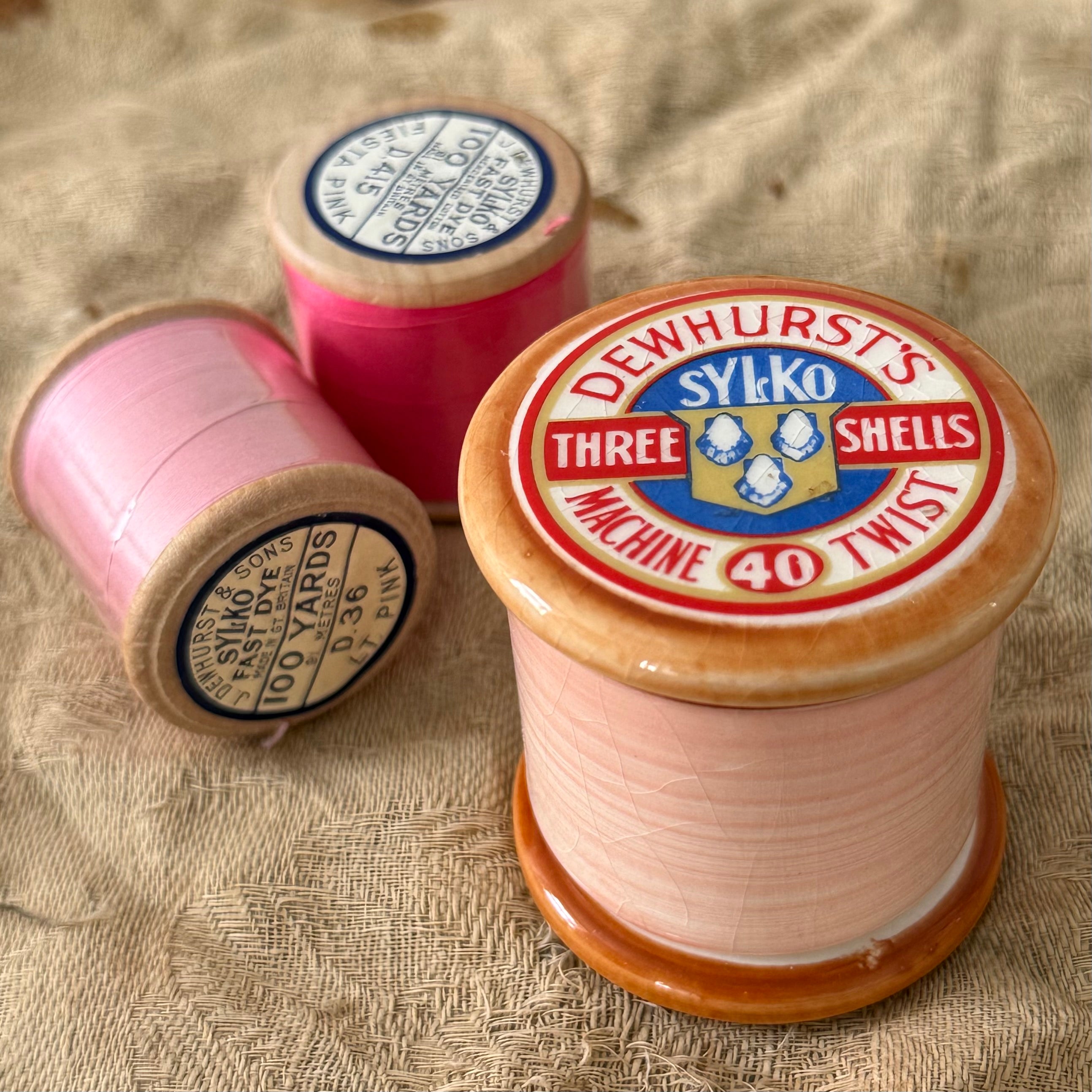 Dewhurst Sylko Three Shells Ceramic Cotton Reel Pot Pink