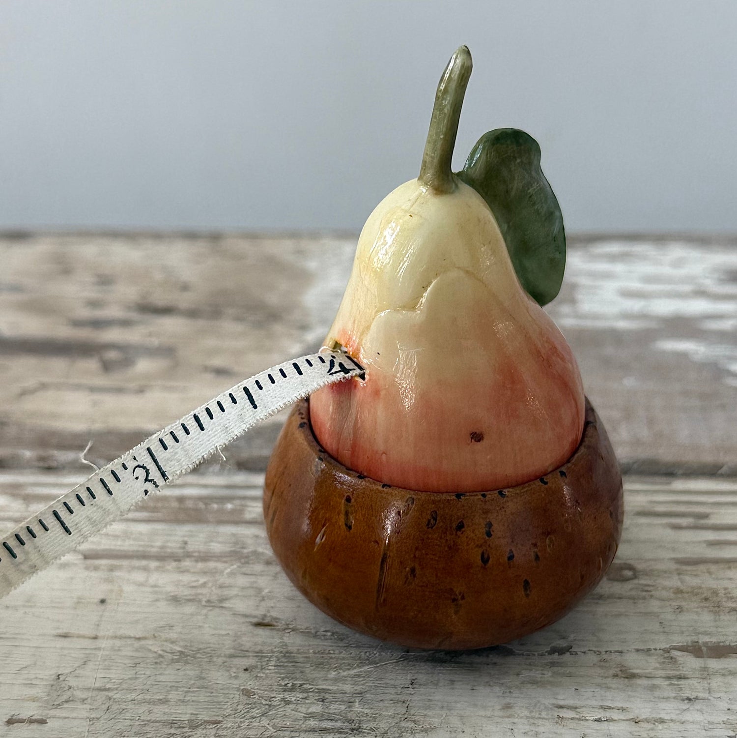 Antique Celluloid Pear Tape Measure in Coquilla Nut Base