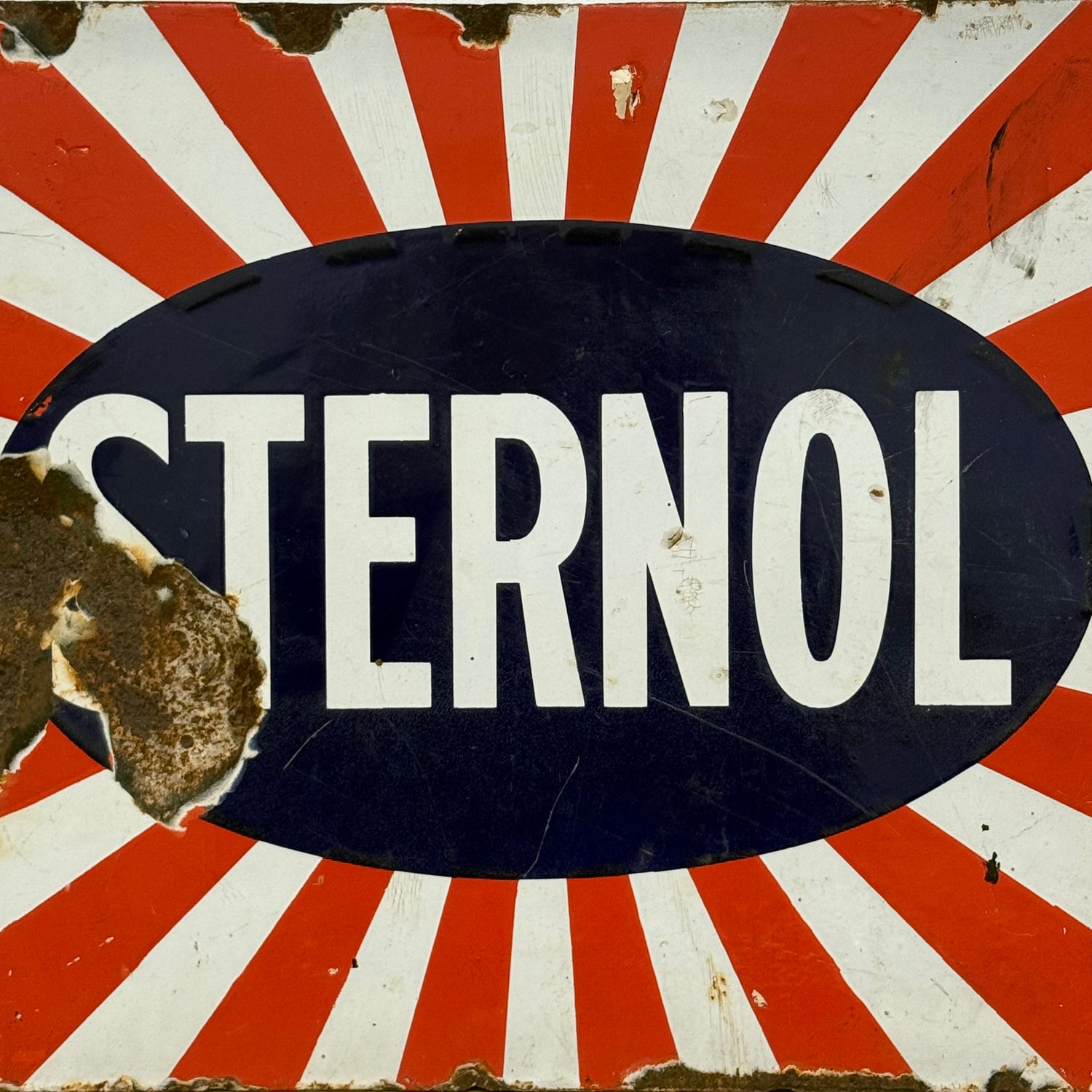 Original Sternol sunburst enamel advertising sign