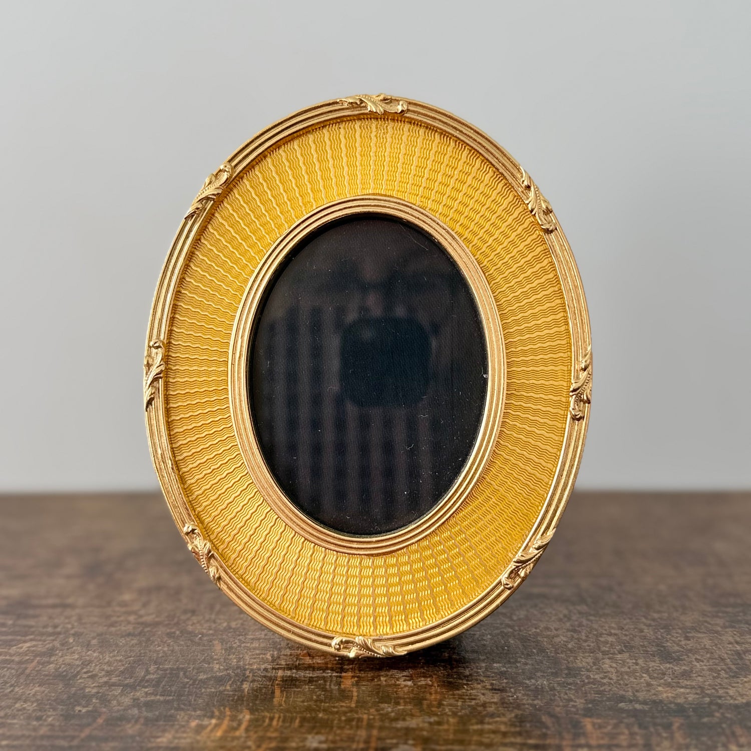 Gold oval frame
