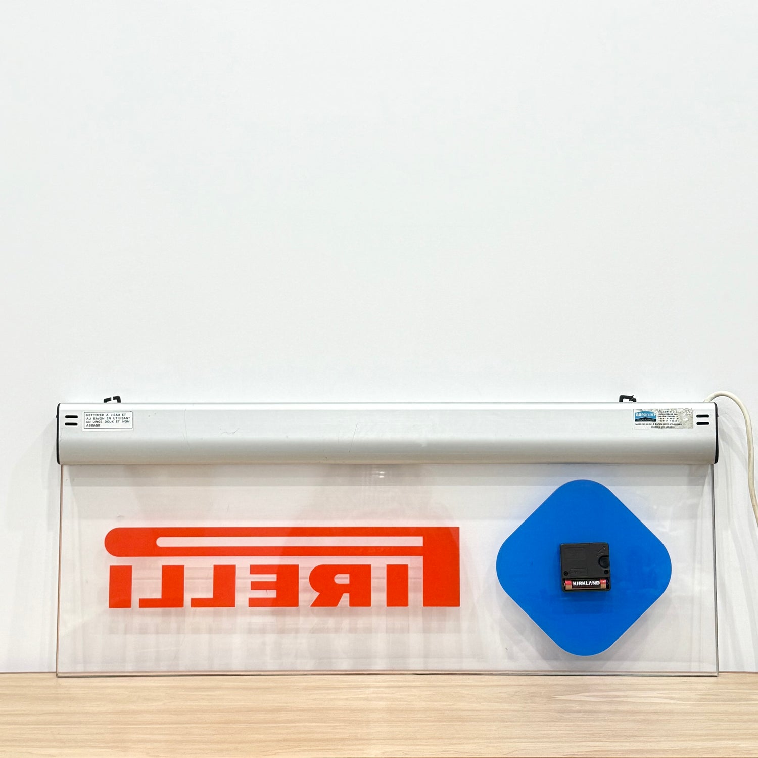 Illuminated Pirelli garage advertising lightbox sign with clock