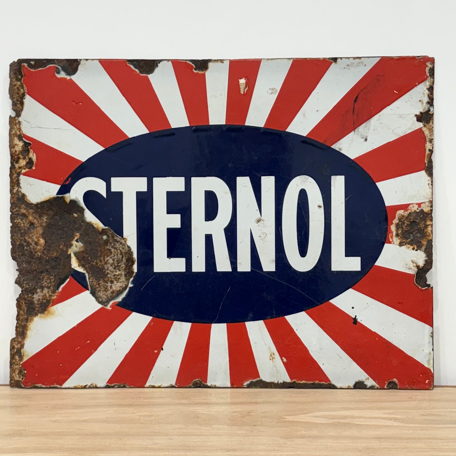 Original Sternol sunburst enamel advertising sign