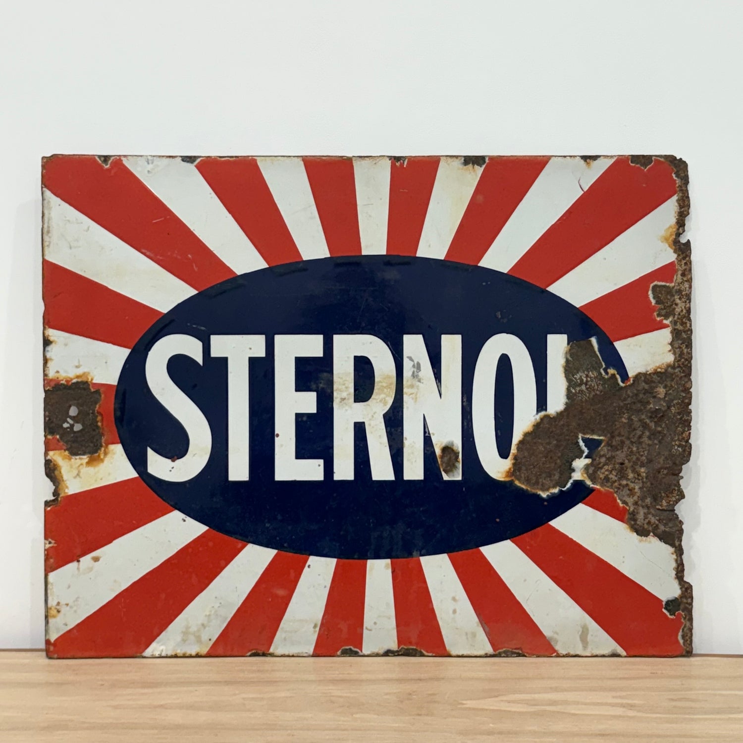 Original Sternol sunburst enamel advertising sign